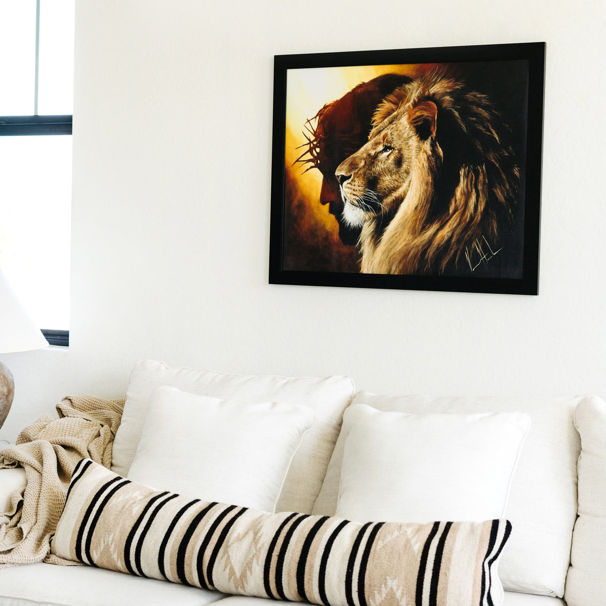 The Lion of Judah Painting haning on a wall above a couch